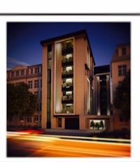 a photo of an apartment building at night